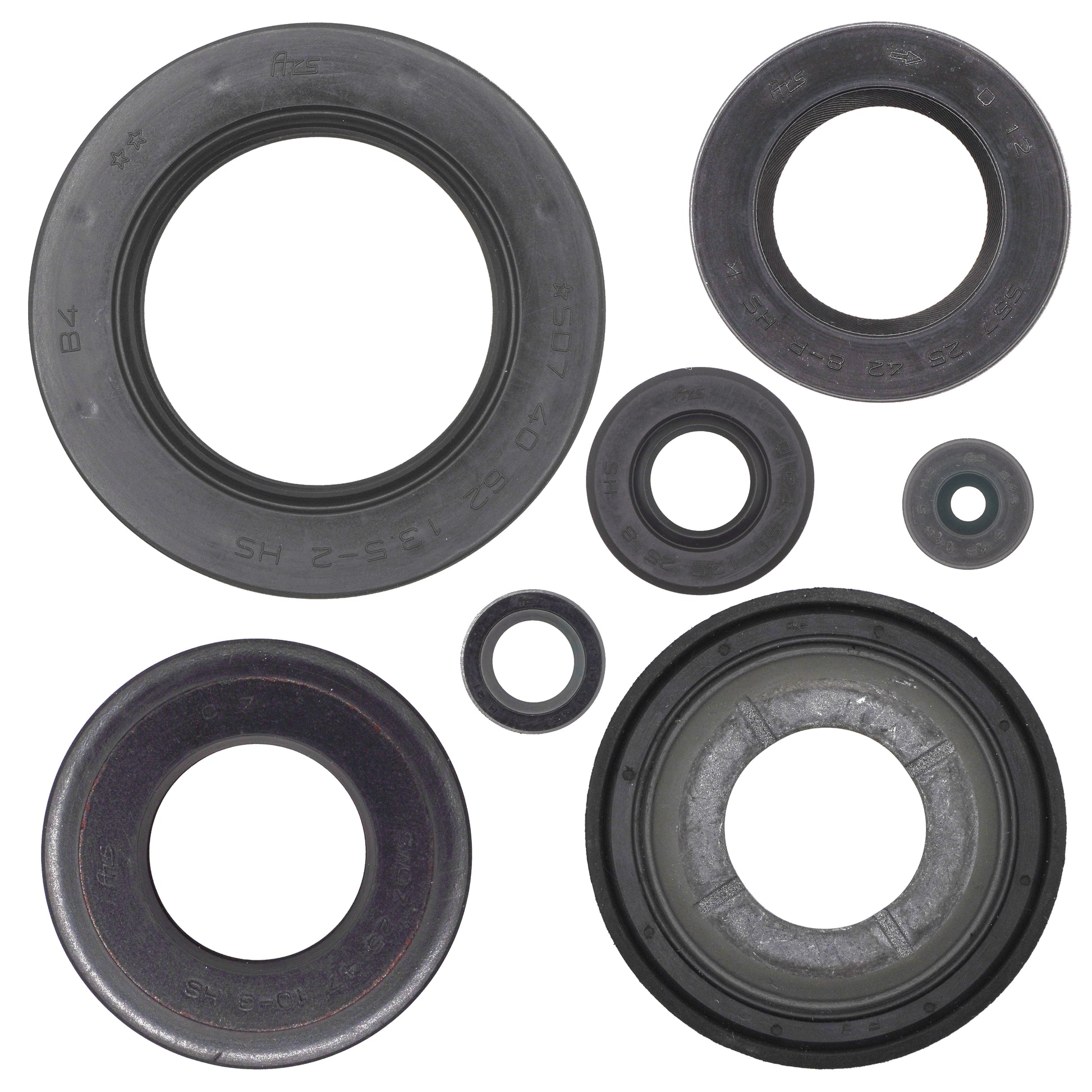 Set of various sizes of black rubber seals on a white background